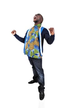A very happy African American young man raising his hands, for white.background, and screaming..