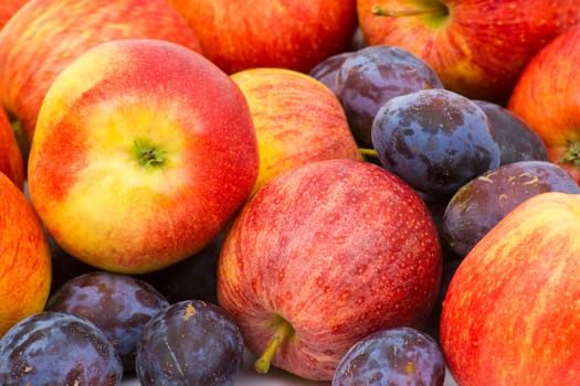fresh apples and plums