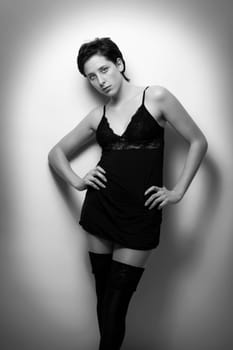 Young beautiful woman in negligee in black and white