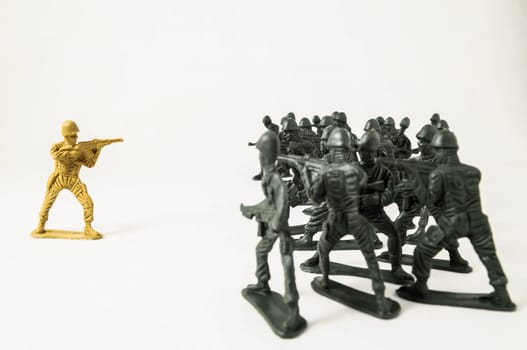 Plastic Lead Soldiers Representing War on a White Background