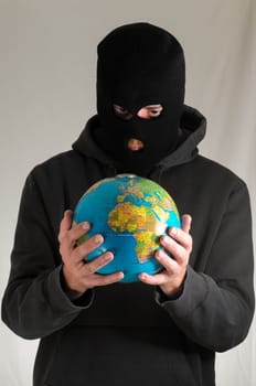 Black Dressed Young Man Holding a Globe Earth