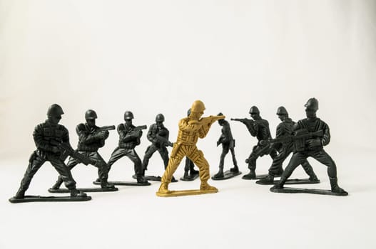 Plastic Lead Soldiers Representing War on a White Background