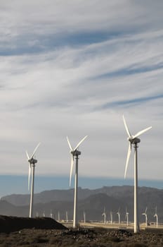Eletric Power Generator Wind Turbine over a Cloudy Sky