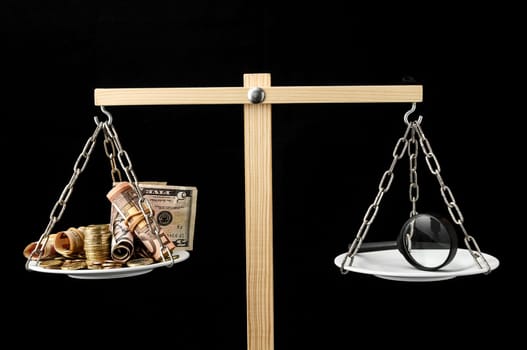 Money and Loupe on a Two Plan Balance Search Concept