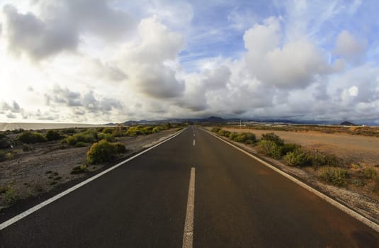 Long Empty Desert Road on a Cludy Day