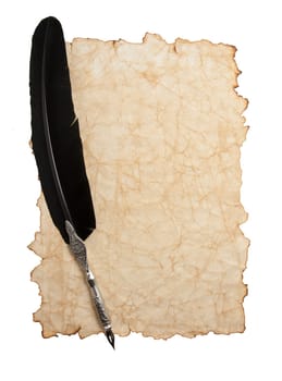 Feather pen and ink bottle on old paper background