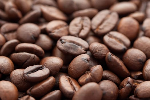 Close-up of brown coffee beans, background texture