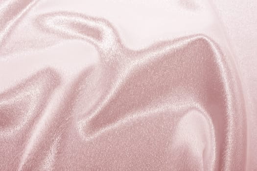 Abstract background pink silk fabric with beautiful waves