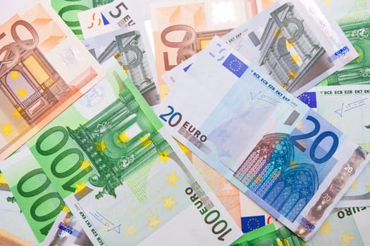 Many euro banknotes making european currency background