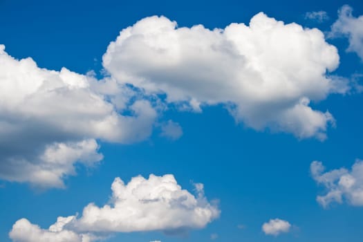 White clouds in blue summer sky background