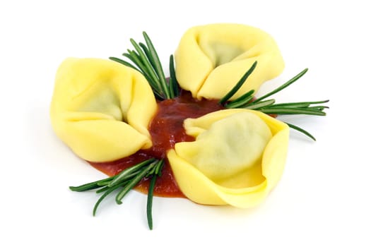 Tortellini,Italian pasta with sugo and rosemary on a white background