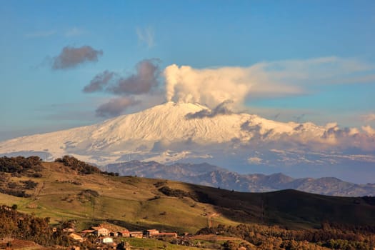 View from Altesina montain of volcano Etna and column of smoke