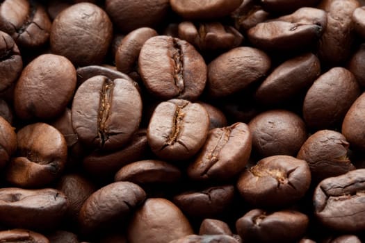 Close-up of brown coffee beans, background texture