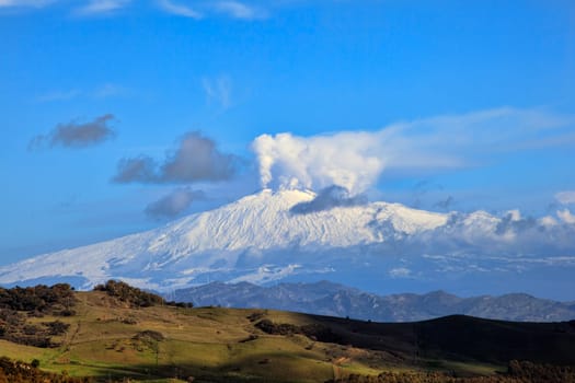 View from Altesina montain of volcano Etna and column of smoke