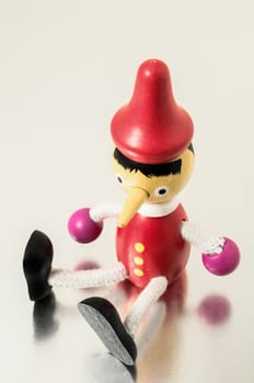 Pinocchio Toy Statue on a Colored Background