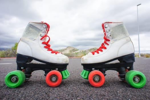 Old Vintage White Skate Boot on the Asphalt Sterret