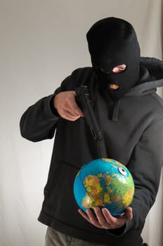 Black Dressed Young Man Holding a Globe Earth