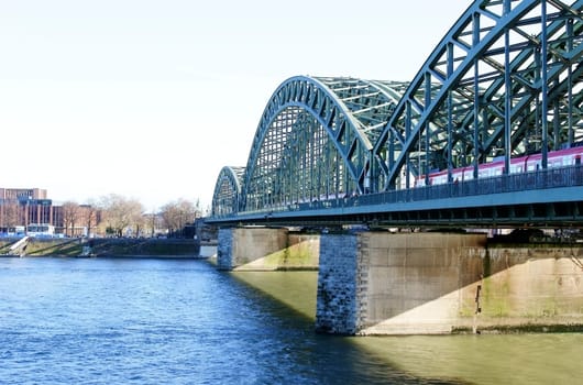 Cologne,Germany – January 02,2014: Walkers cross the Hohenzollern Bridge to cross the Rhine in Cologne on January 2,2014.