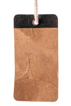 Blank old brown label with string on a white background
