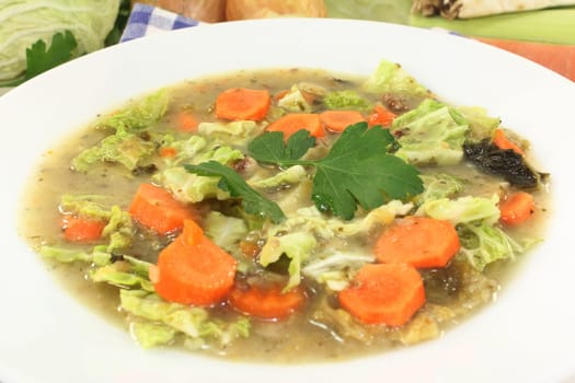 a white plate with savoy cabbage stew