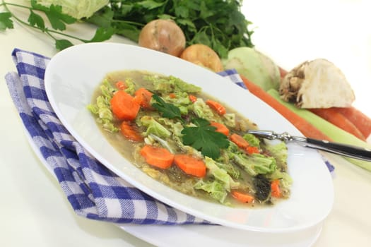 a white plate with savoy cabbage stew