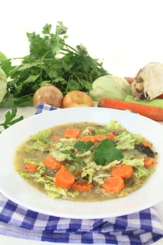 a white plate with savoy cabbage stew