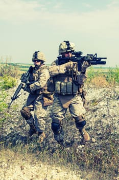 Two soldiers in the mountains during the military operation