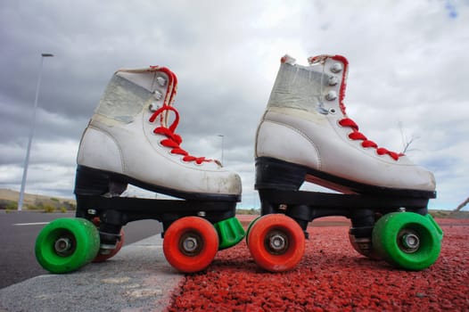 Old Vintage White Skate Boot on the Asphalt Sterret