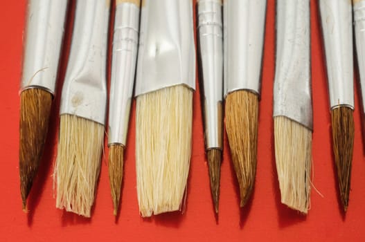 New Wooden Different Paintbrush Set Texture over a Colored Background