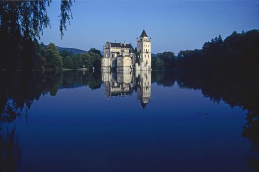 Castle Anif with lake in Austria