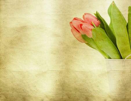 Red tulips over grunge painted background