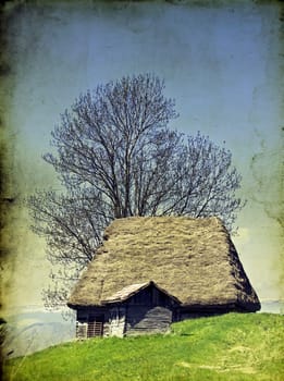 Old house in the mountains on vintage grunge background