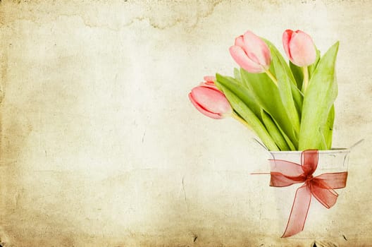 Beautiful pink tulips on vintage background