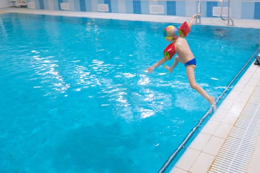 boy jumping in pool. High quality photo