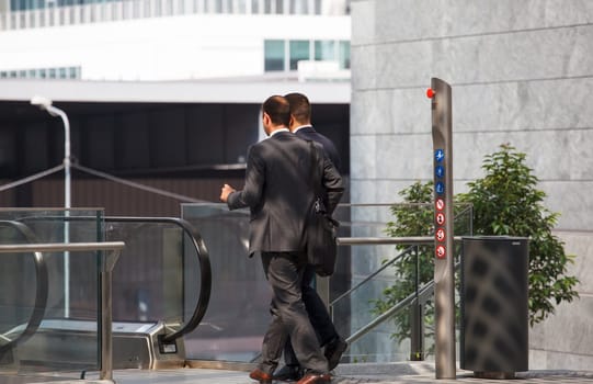 business men walking with travel bag