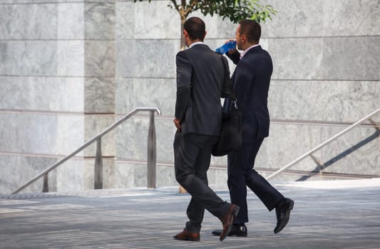 business men walking with travel bag