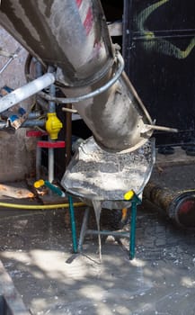 View of Cement Truck in action in a construction site
