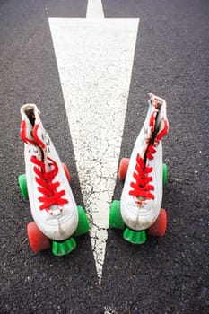 Old Vintage White Skate Boot on the Asphalt Sterret