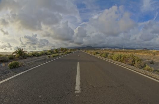 Long Empty Desert Road on a Cludy Day