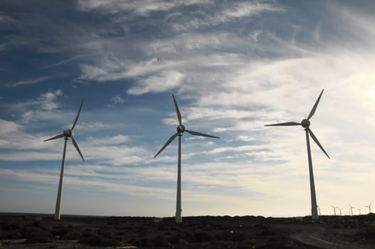 Eletric Power Generator Wind Turbine over a Cloudy Sky