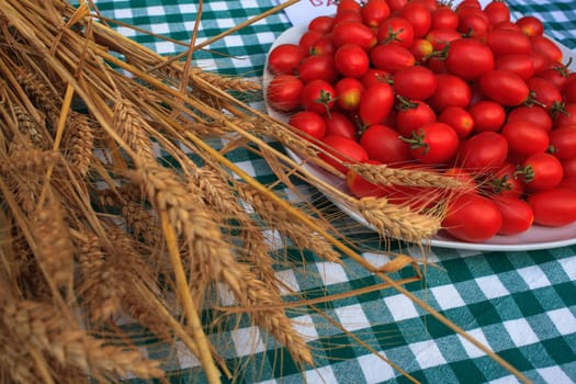 View of Wheat and tomatoes on tablecloth