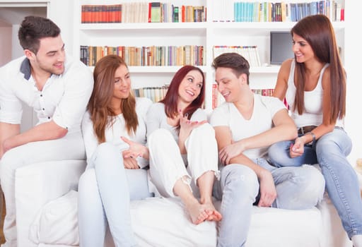 Group of pretty young people smiling on the couch