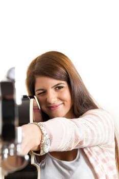 girl pointing with a guitar ostraight to camera
