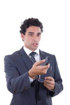 Man in suit holding glasess and changing channel with remote
