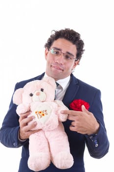 clumsy man with glasses holding a teddy menu