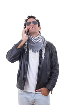 handsome man in a leather jacket talking over phone