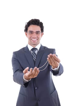man in suit with glasess offers a silver necklace