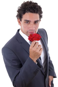 handsome man in suit seduces with rose