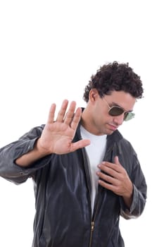 man in a leather jacket with sunglasses showing stop with his hand