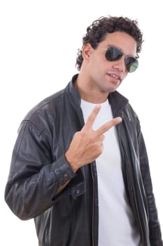 handsome man in a leather jacket with sunglasses showing peace